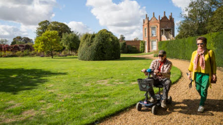 PMV in garden at Melford Hall National Trust, Suffolk, with fellow walker